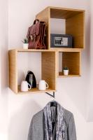 a shelf with a clock and a bag at 9Hotel Bastille-Lyon in Paris