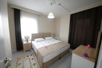 Postel nebo postele na pokoji v ubytování city59 Suit Otel