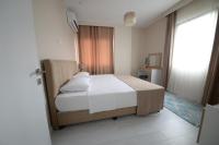 Postel nebo postele na pokoji v ubytování city59 Suit Otel