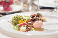 a white plate of food on a table at Mi Pueblo Samary Hotel Boutique in Sucre