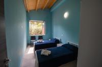 A bed or beds in a room at "Il Segreto" Vista Panoramica sulle Isole Eolie con Piscina, palestra e WiFi