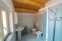 A bathroom at "Il Segreto" Vista Panoramica sulle Isole Eolie con Piscina, palestra e WiFi