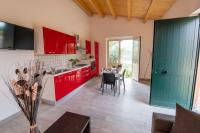 A kitchen or kitchenette at "Il Segreto" Vista Panoramica sulle Isole Eolie con Piscina, palestra e WiFi