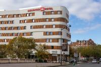 a building with a sign on top of it at MEININGER Hotel Paris Porte de Vincennes in Paris