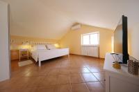 Posteľ alebo postele v izbe v ubytovaní Apartments Villa Marnii