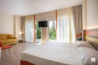 Postel nebo postele na pokoji v ubytování Tonicello Hotel Resort & SPA