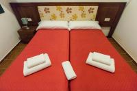 A bed or beds in a room at Hostal Rural La Fonda Del Rocio