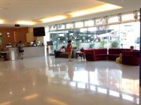 a lobby with couches and people in a building at Tie Dao Hotel in Tainan