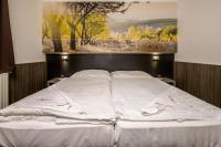 Posteľ alebo postele v izbe v ubytovaní Andante Pension & Restaurant