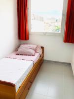 Postel nebo postele na pokoji v ubytování La Marina SeaView Penthouse