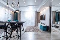 Televízia a/alebo spoločenská miestnosť v ubytovaní Resort Apartamenty Klifowa Rewal 27
