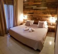 Posteľ alebo postele v izbe v ubytovaní Anemos Hotel