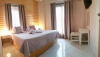 Posteľ alebo postele v izbe v ubytovaní Anemos Hotel