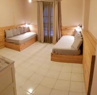 Posteľ alebo postele v izbe v ubytovaní Anemos Hotel