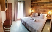 Posteľ alebo postele v izbe v ubytovaní Anemos Hotel