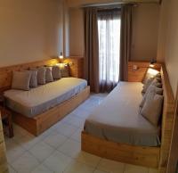 Posteľ alebo postele v izbe v ubytovaní Anemos Hotel