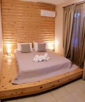 Posteľ alebo postele v izbe v ubytovaní Anemos Hotel