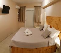 Posteľ alebo postele v izbe v ubytovaní Anemos Hotel