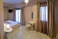 Posteľ alebo postele v izbe v ubytovaní Anemos Hotel