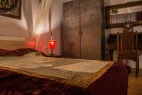 Postel nebo postele na pokoji v ubytování Dharma Luxury & Spa Apartment