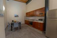 A kitchen or kitchenette at "Il Segreto" Vista Panoramica sulle Isole Eolie con Piscina, palestra e WiFi