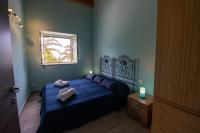 A bed or beds in a room at "Il Segreto" Vista Panoramica sulle Isole Eolie con Piscina, palestra e WiFi