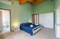 A bed or beds in a room at "Il Segreto" Vista Panoramica sulle Isole Eolie con Piscina, palestra e WiFi