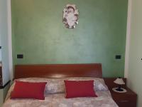 A bed or beds in a room at B&B da Silvana a Talamello