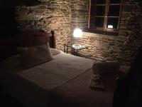 A bed or beds in a room at Casa Ferreiro - Campo da Cruz - Lugo