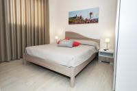 A bed or beds in a room at Le Dimore di Otranto