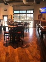 a dining room with wooden tables and chairs at Holiday Inn Rock Springs by IHG in Rock Springs