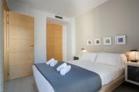A bed or beds in a room at BBarcelona Gaudí Flats