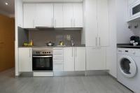A kitchen or kitchenette at BBarcelona Gaudí Flats