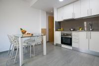A kitchen or kitchenette at BBarcelona Gaudí Flats