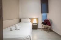 A bed or beds in a room at BBarcelona Gaudí Flats