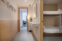 A bed or beds in a room at BBarcelona Gaudí Flats