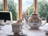a tea pot and a cup on a table at Hollins Hall Hotel, Spa & Golf in Bradford