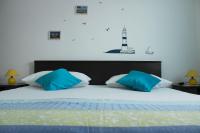 Łóżko lub łóżka w pokoju w obiekcie Apartments Luna
