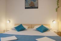 Łóżko lub łóżka w pokoju w obiekcie Apartments Luna