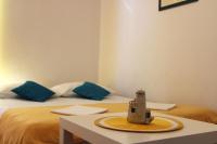Łóżko lub łóżka w pokoju w obiekcie Apartments Luna