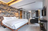 Le Dortoir Boutique Suitesにあるベッド