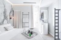 Le Dortoir Boutique Suitesにあるベッド