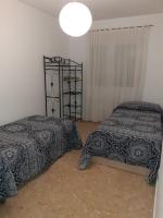 Postel nebo postele na pokoji v ubytování Apartamento El Portiel