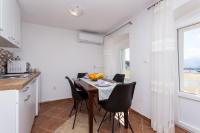 Kuchyň nebo kuchyňský kout v ubytování Apartmani Obala