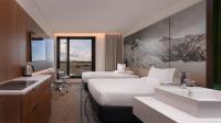 Novotel Christchurch Airportにあるベッド