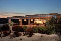 a large house with a dining area in front of it at White Dunes Luxury Boutique Hotel in Santa Maria
