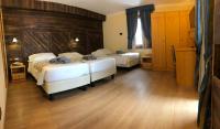 Una cama o camas en una habitaci&oacute;n de Hotel Edelweiss 3 Stelle SUPERIOR