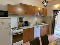 Kuchyň nebo kuchyňský kout v ubytování Apartmani Spomenka