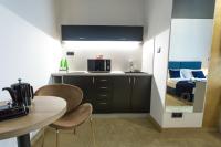 A kitchen or kitchenette at Apart Hotel GOLDEN apartments