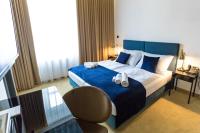 A bed or beds in a room at Apart Hotel GOLDEN apartments